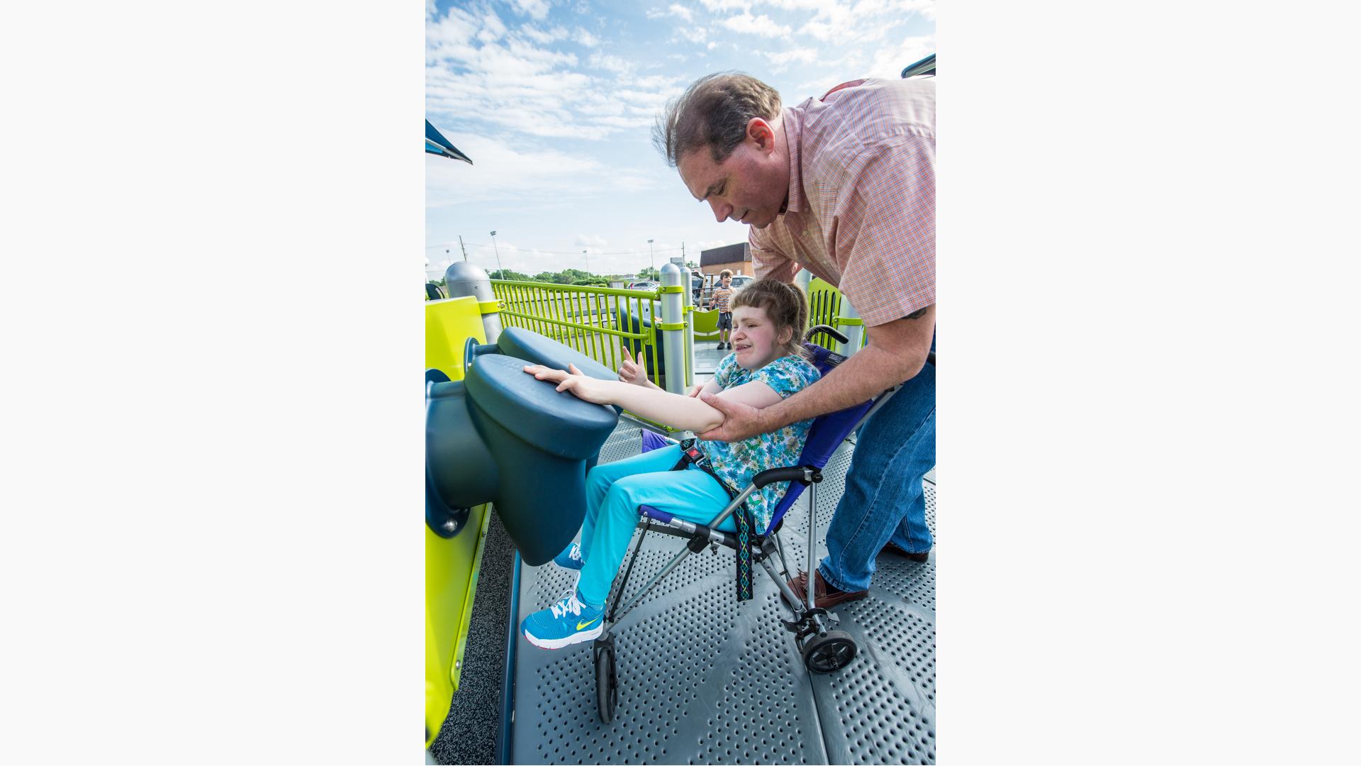 Girl learning to use Bongo Reach Panel