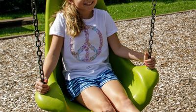 Girl sitting in Molded Bucket Seat w/Chains