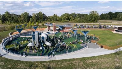 Families pack in to West Commons Playground at Central Park for numerous play activities. 