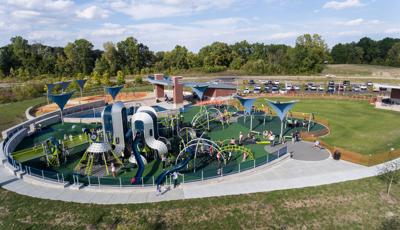 Families pack in to West Commons Playground at Central Park for numerous play activities. 