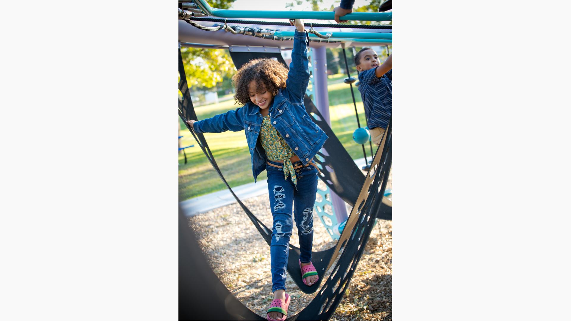 Girl in denim jacket walking through ramps in Quantis™ netplay concept