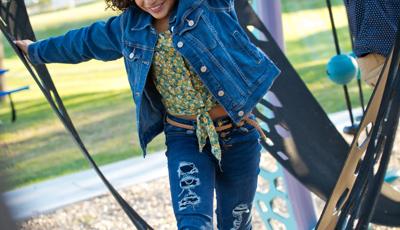 Girl in denim jacket walking through ramps in Quantis™ netplay concept