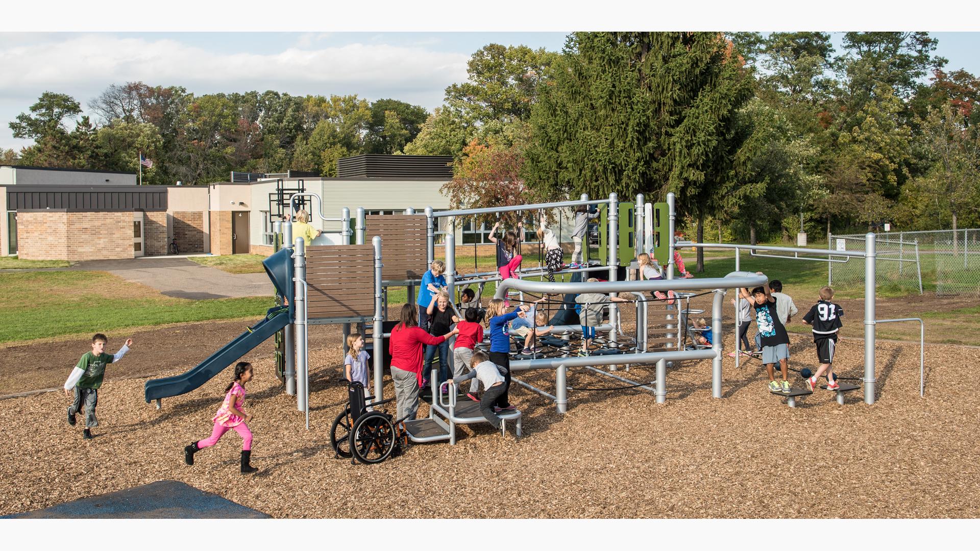 Children of all abilities play on a play structure with silver, navy blue coloring, and wood accents with unique rope climbers and a variety of overhead, climbing and play activities.