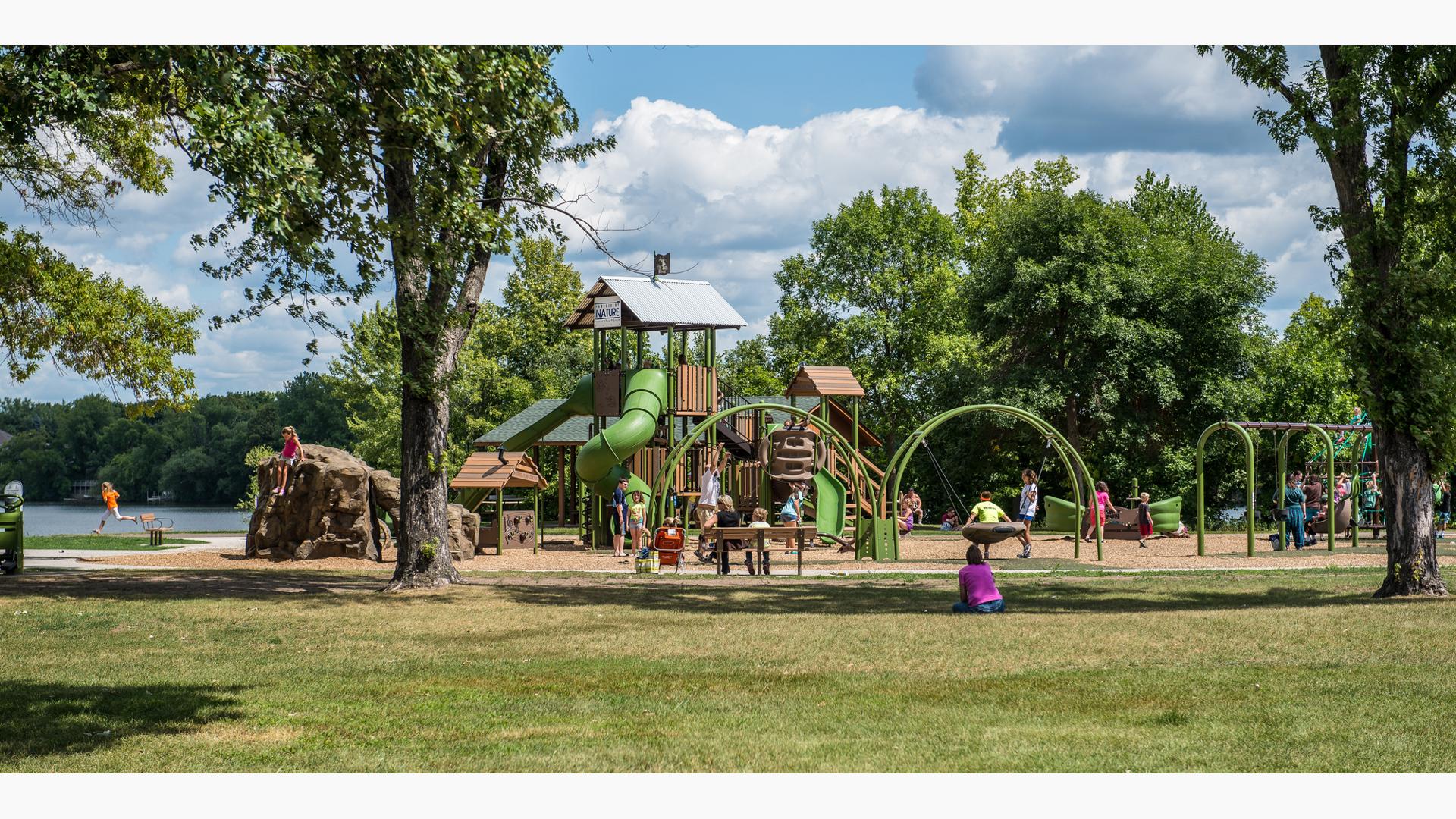 Orono Park, Elk River, MN features a  tower tree house as the main play structure.  In addition, there are nature-inspired rock climbers, swings, spinners and more. The park also includes the HealthBeat® outdoor fitness system for parents.