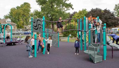 Komensky Elementary playground in Berwyn, IL, brought by KABOOM! features a Cascade Climber, a Canyon Climber, and a Double Swoosh Slide®. The PlayBooster® play structure also features freestanding play components like the We-Saw™, Saddle Spinners, Bobble Riders and swings. Best of all, the playground incorporates the school colors.