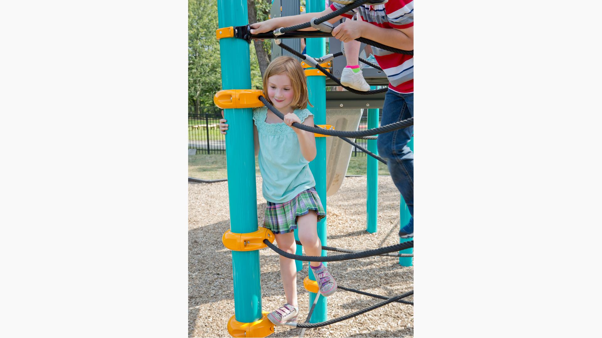 Girl smiling in Netplex Climber