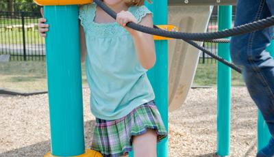 Girl smiling in Netplex Climber