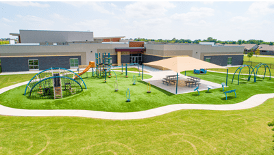 Morrow Elementary playground  kids ages 2-to-5 and 5-12. This school playground includes freestanding play elements like Curva® Spinner, We-Go-Round® and Rhapsody® Outdoor Musical Instruments as well a picnic area covered by a SkyWays® Hip shade structure.