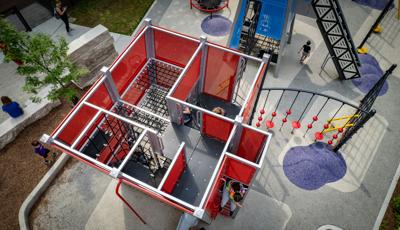 Aerial of children inside custom play structure Seneca Park, Eli M. Schulman Playground