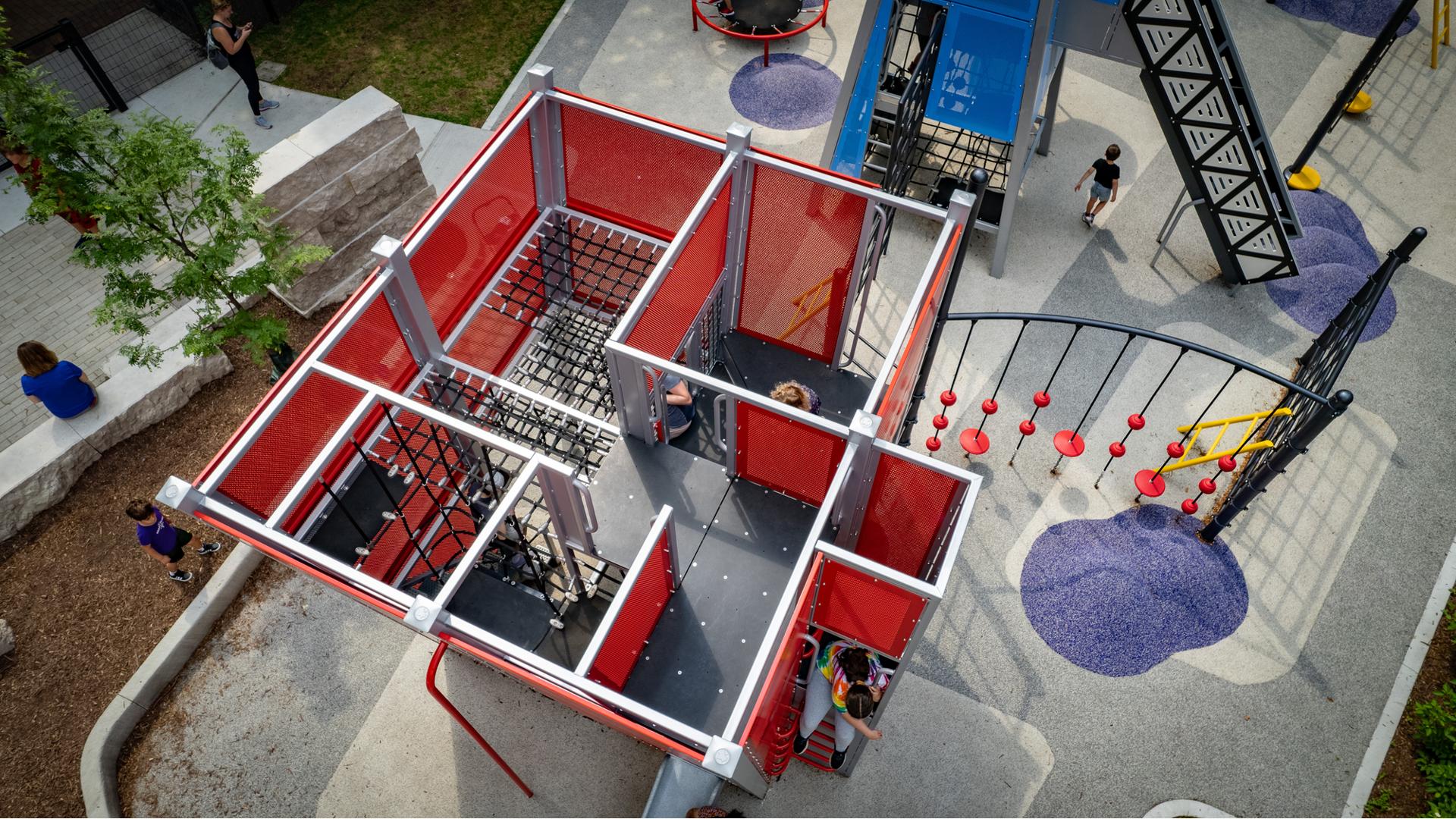 Aerial of children inside custom play structure Seneca Park, Eli M. Schulman Playground