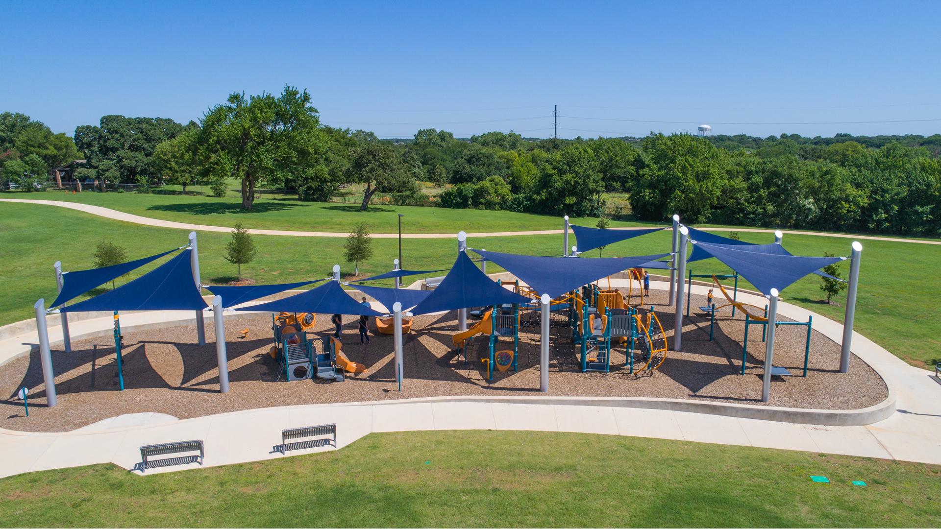 Northfield Park Richland Hills, TX. Features separate play structures, each of which is packed full of engaging playground components like climbers, slides and activity panels. The ZipKrooz®, OmniSpin® spinner, Sensory Play Center®, Oodle Swing® and more. Plus, heavy duty commercial shade sails from SkyWays®
