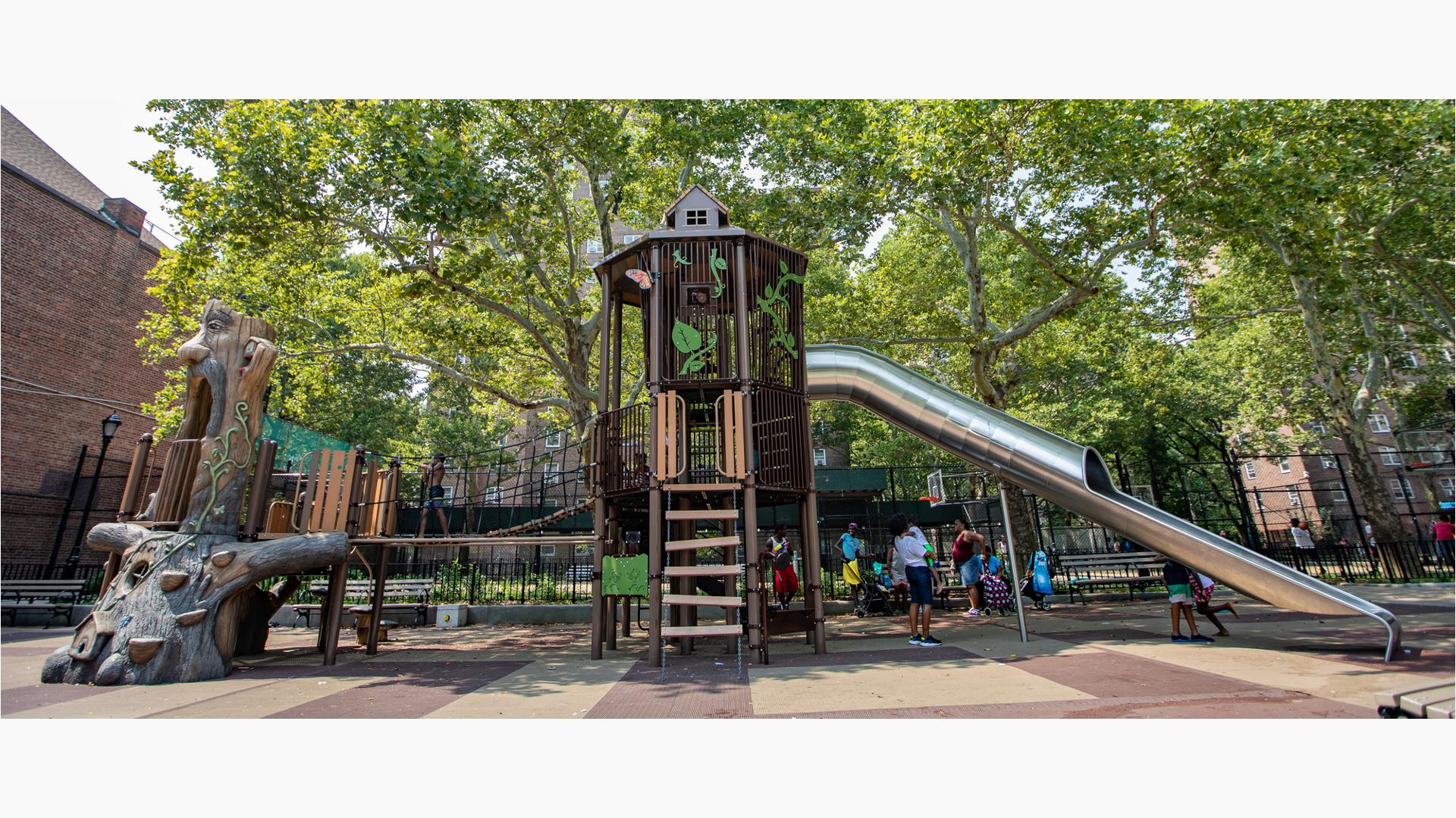 Adutls stand with their babies under nature-inspired play structure, while kids walk across the wooden bridge and run around the stainless steel tunnel slide.