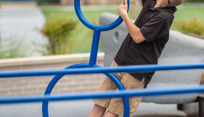 Boy playing on Gyro Twister® Spinner
