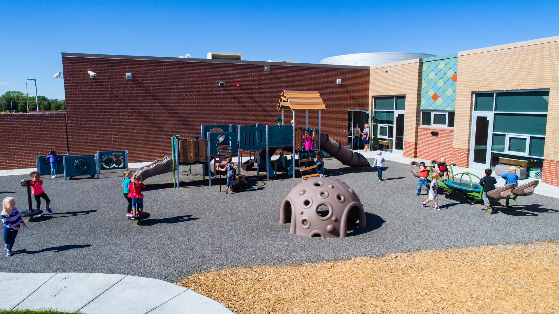 Maize Early Childhood Center, Wichita, KS  includes Loft, a part of the Smart Play® family, Clubhouse, OmniSpin® spinner and Rhapsody® Outdoor Musical Instruments.  The playground also includes a PlayShaper® playstructure, We-saw™, Cozy Dome®, and playground swings.