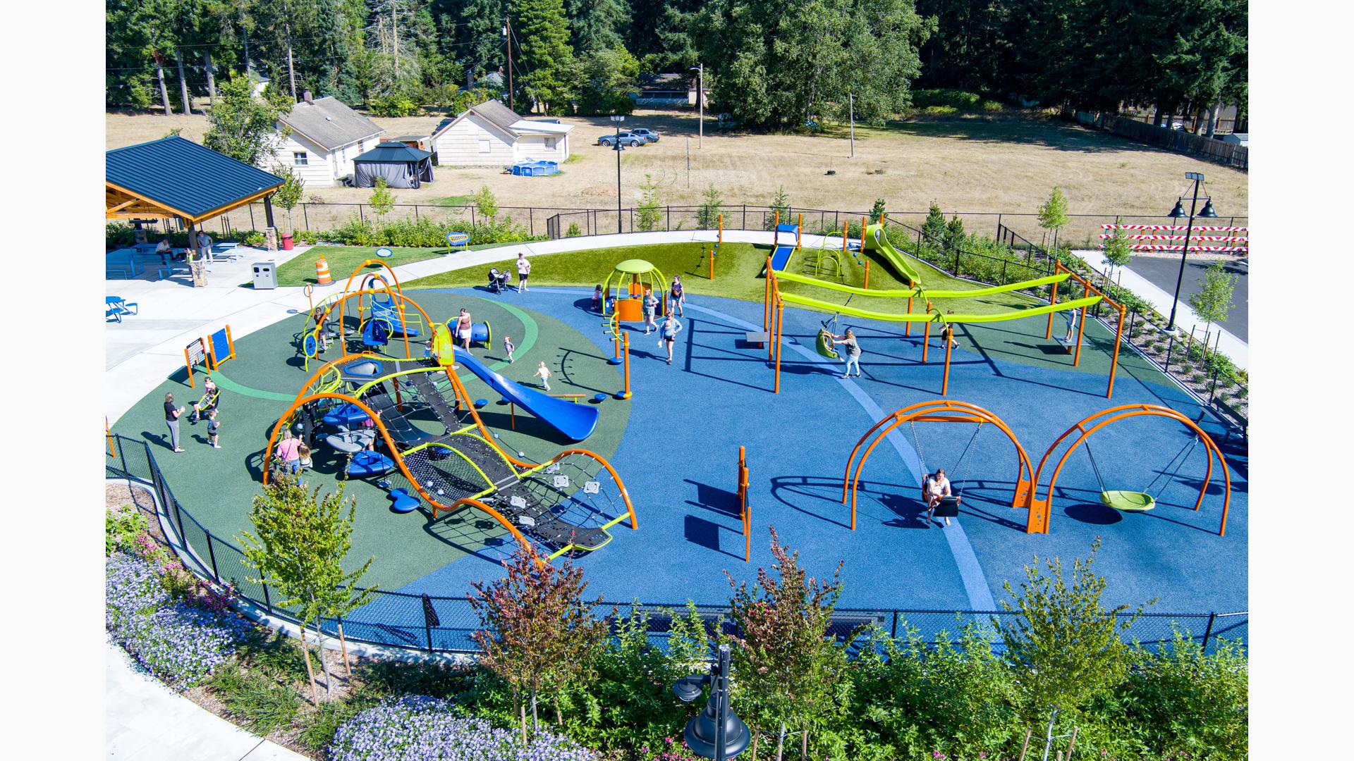 Elevated view of children playing on an inclusive playground.