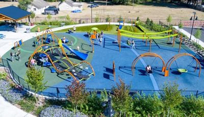 Elevated view of children playing on an inclusive playground.