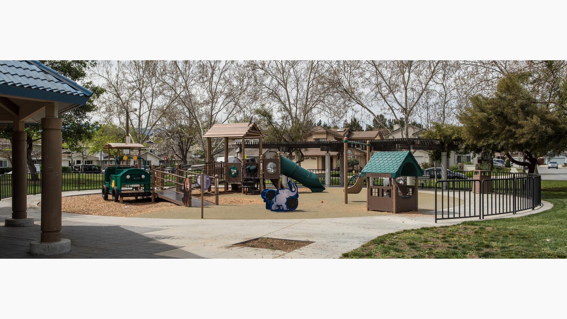safari-themed PlayBooster® play structure in San Jose, California, for ages 5 to 12. The custom nature-inspired playground, is incorporating Recycled Wood-Grain panels and roofs. Ramps have been included to make the experience accessible.