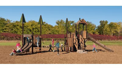 Kids playing on PlayBooster playground at Crimson Park. Littles ones line up for double slide, while two little girls ride toward the bottom. A girl runs across the play structure toward the stairs on the façade.