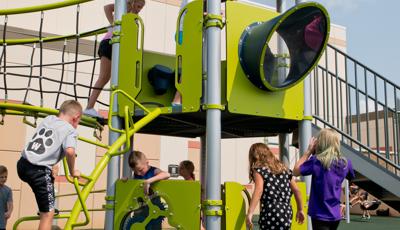 Kids playing on play structure