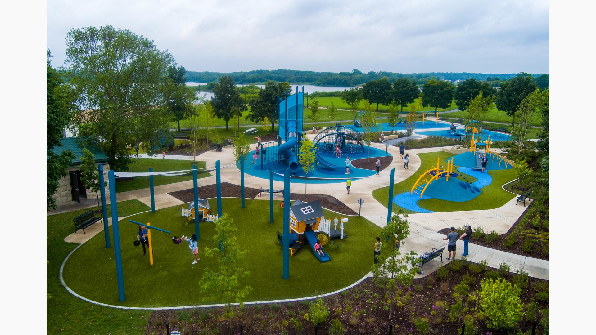 Elevated view of a park playground with designated areas with different structures for all ages.