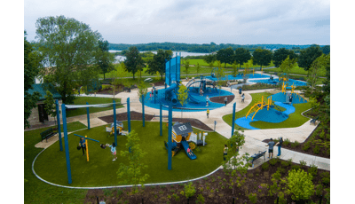 Elevated view of a park playground with designated areas with different structures for all ages.