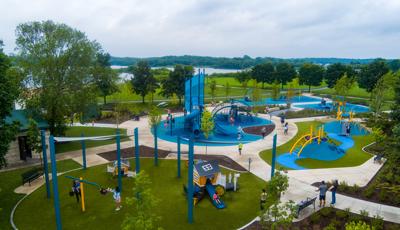 Elevated view of a park playground with designated areas with different structures for all ages.