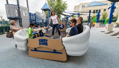 People smiling as they ride the Sway Fun® Glider (16")