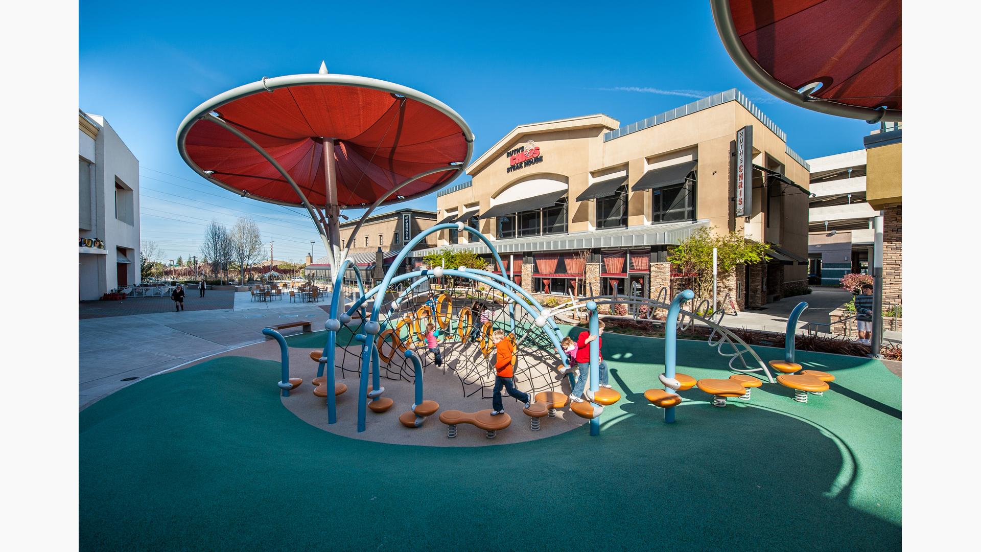 Kids running on Wobble Pod bouncers and Noodle Pod Steps.