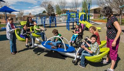 Children of Fletcher Miller School play on a We-saw™ with their teachers.