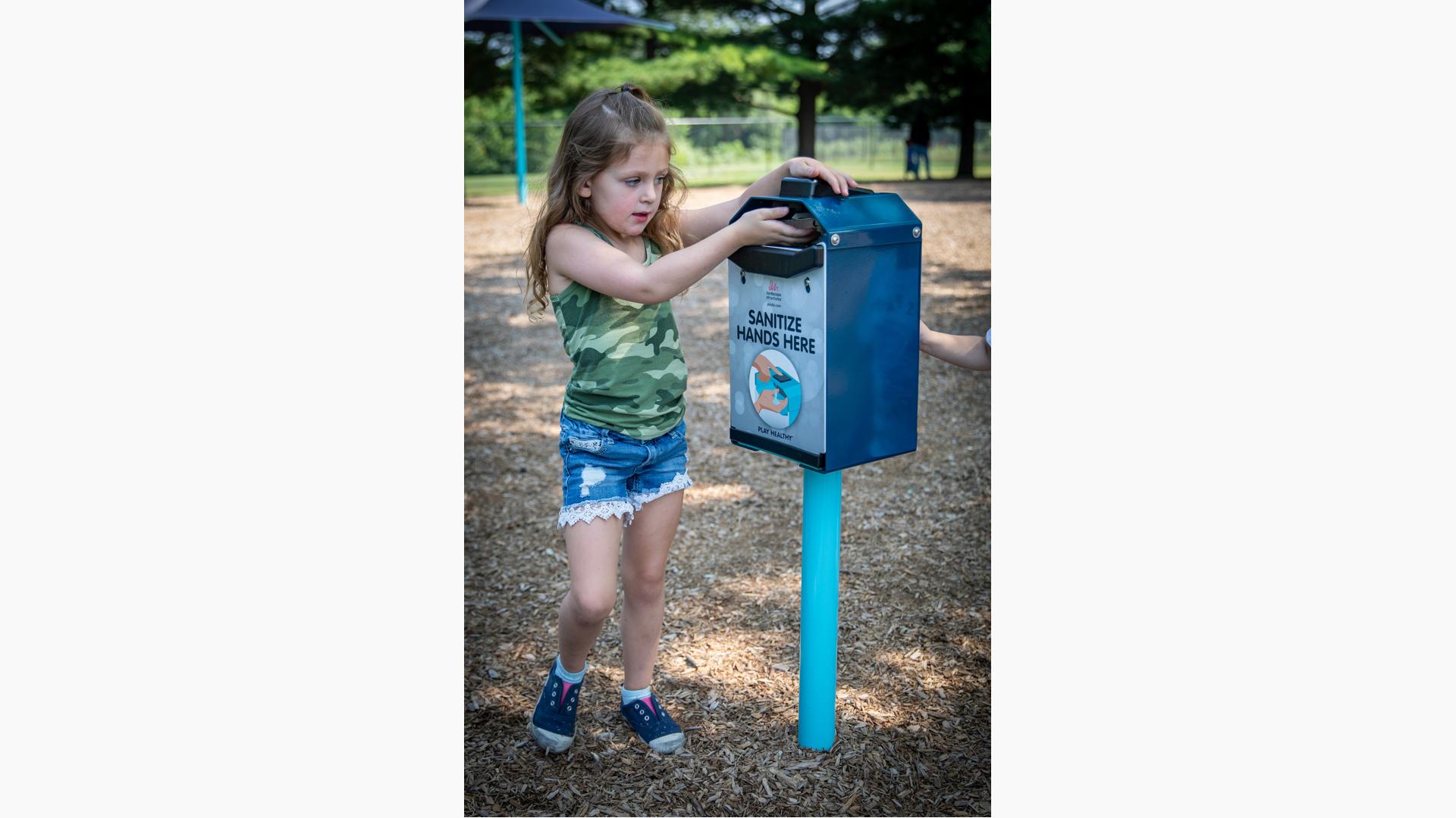 Girl squirting hand sanitizer 