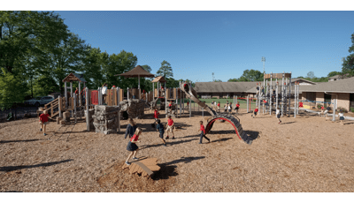Children at Hammond School playing on this nature-inspired playground. The PlayBooster play structure is packed with kids, while the Netplex is overrun with active kids.
