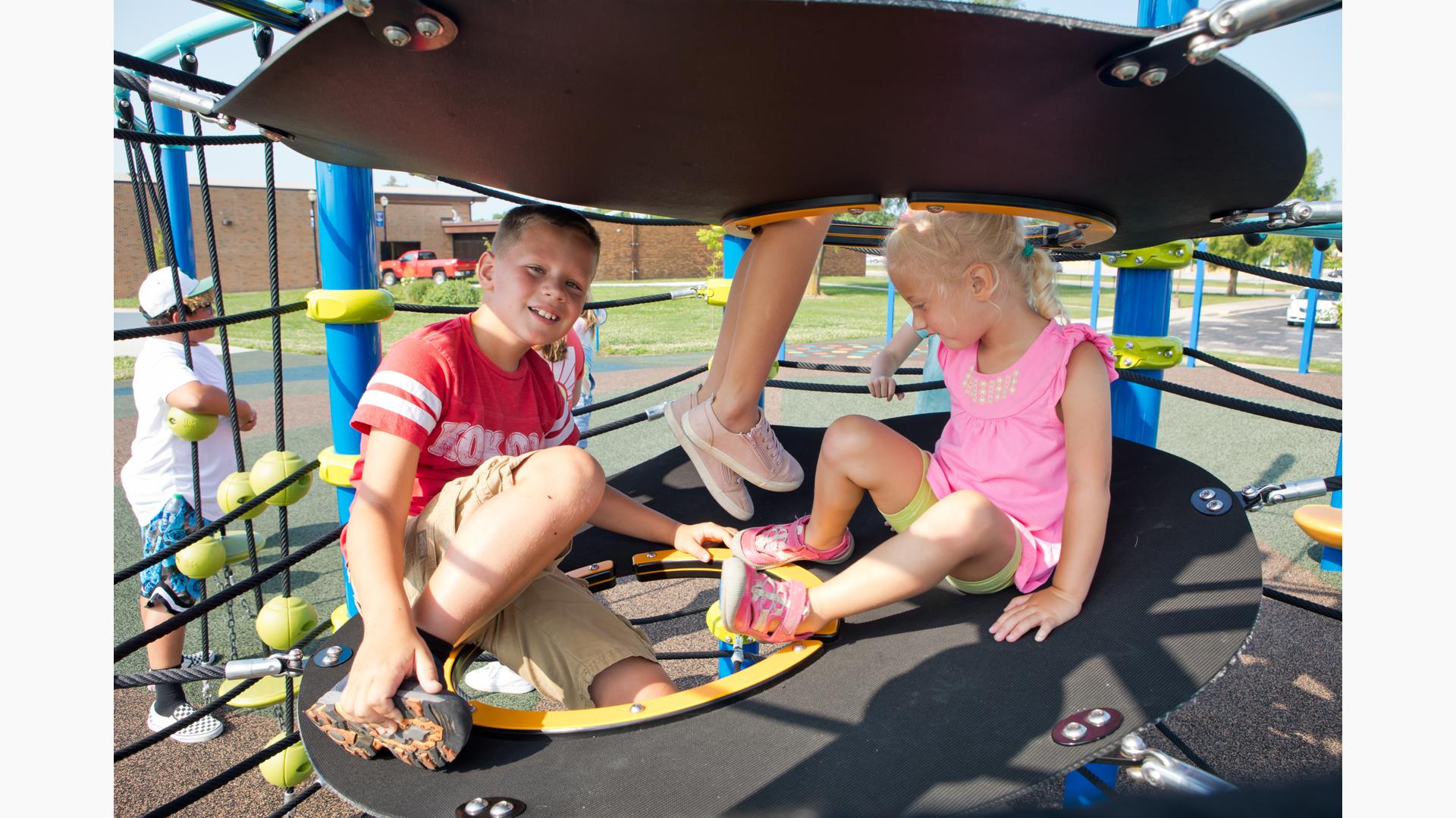 Kids smiling on Netplex® play structure