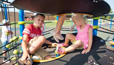 Kids smiling on Netplex® play structure