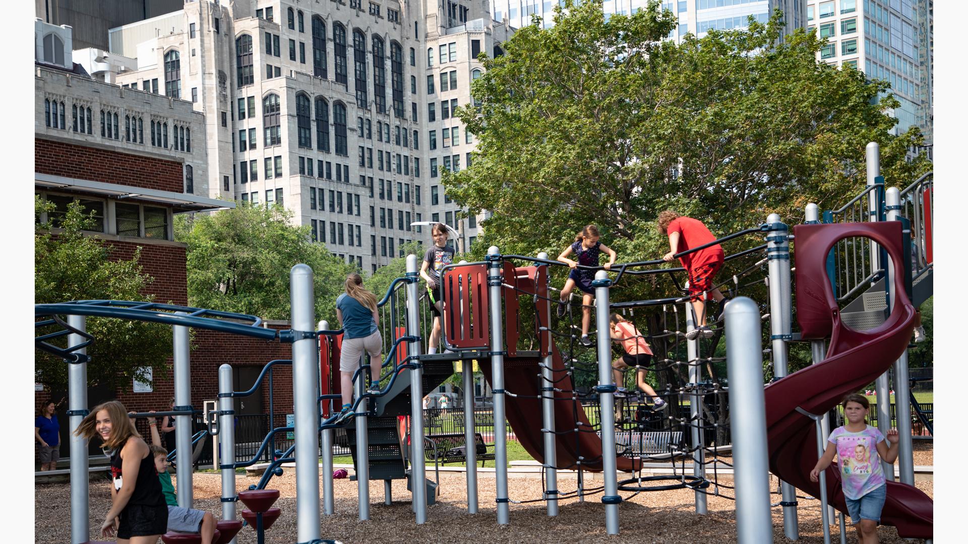 KIds climbing on fish net climber and jig jag climber at Lake Shore Park