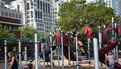 KIds climbing on fish net climber and jig jag climber at Lake Shore Park