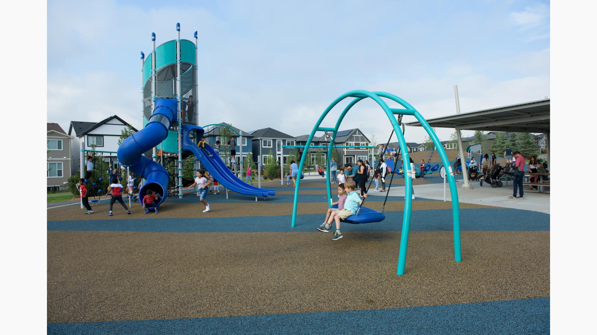 Two boys sitting on Oodle® Swing