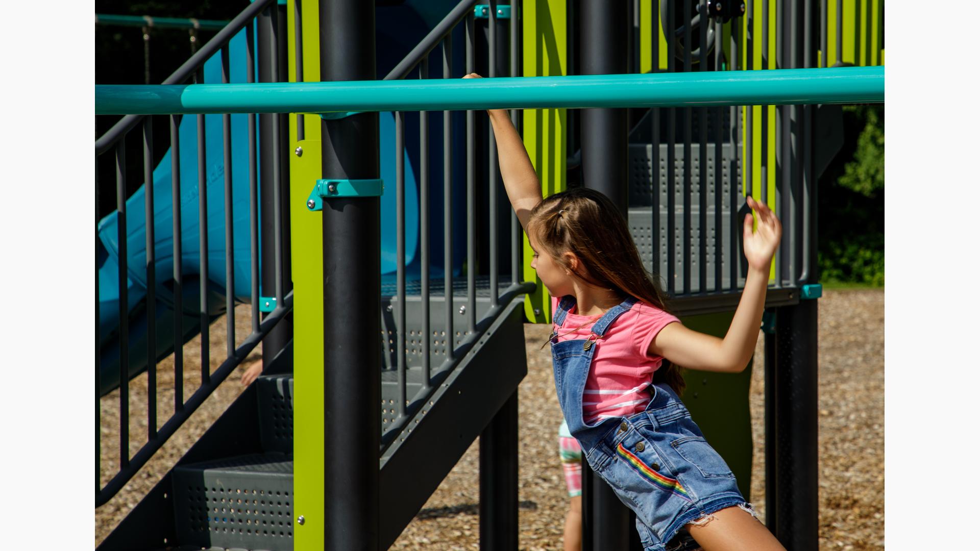 Girl swings on Horizontal Ladder