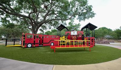 View of Roller Table™ with custom fire truck play structure in the background
