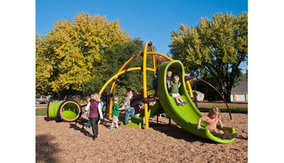 Toddlers swarm over the Weevos play system in St. Joseph's Youth Center. A long line of children forms for the slide.