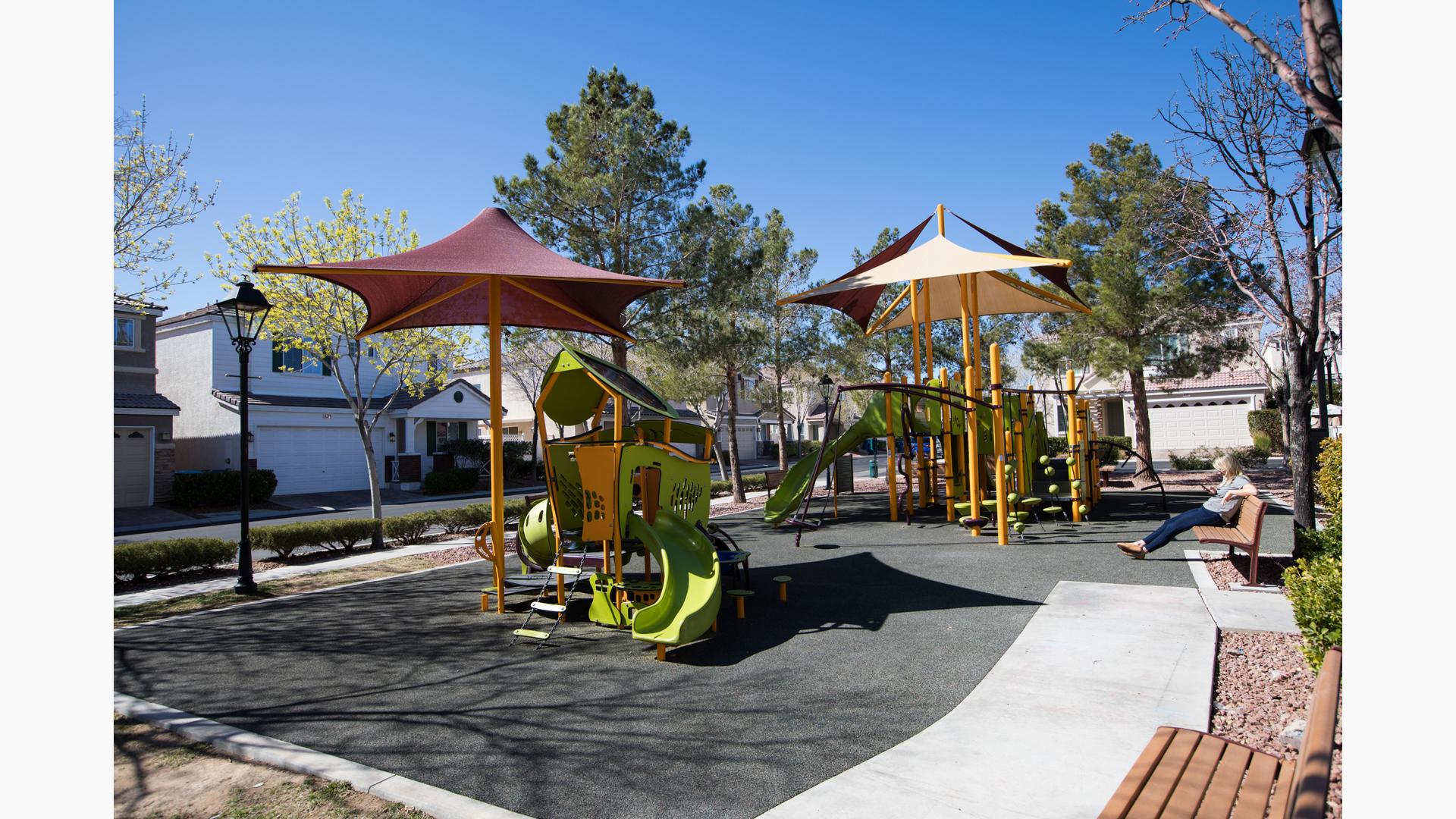 Lamplight Square at Coronado Ranch
Las Vegas, NV. The PlayBooster® playstructure for ages 5 to 12 includes playground slides and climbers, interactive play panels and spinners. Nearby, a Smart Play® play structure for ages 2 to 5. This  delivers 16 different play activities ranging from musical panels, crawl tunnels and slides. All is covered by CoolToppers® shade structures.
