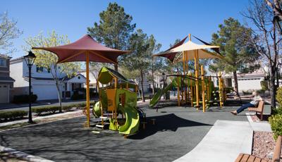 Lamplight Square at Coronado Ranch
Las Vegas, NV. The PlayBooster® playstructure for ages 5 to 12 includes playground slides and climbers, interactive play panels and spinners. Nearby, a Smart Play® play structure for ages 2 to 5. This  delivers 16 different play activities ranging from musical panels, crawl tunnels and slides. All is covered by CoolToppers® shade structures.