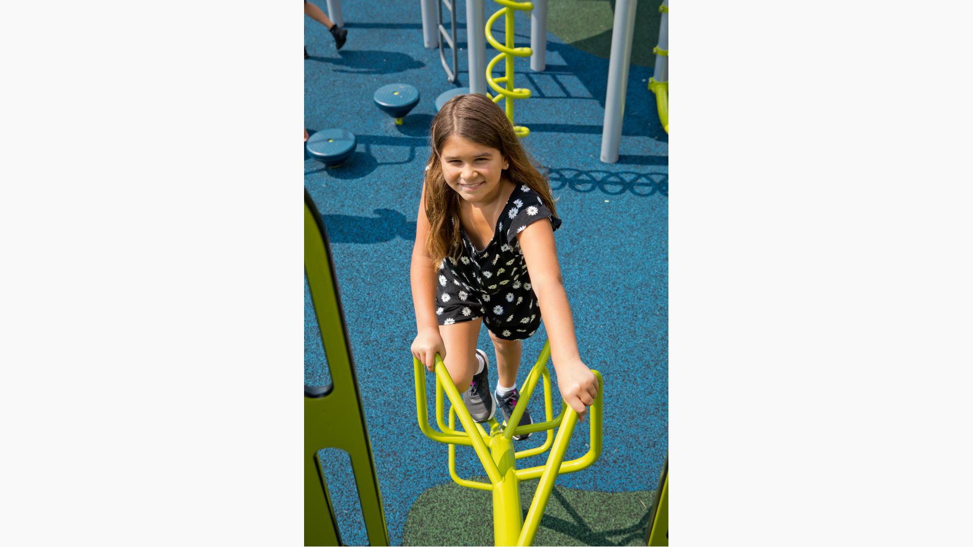 Girl smiling on Croquet Climber