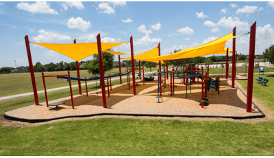 Holly Bay Park in Pasadena, TX houses PlayBooster® playstructure, OmniSpin® Spinner and ZipKrooz® and is nestled under SkyWays® Shade products.