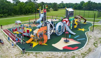 Elevated view of a sports themed playground where the letters of "Sports" makes up the main play structure.
