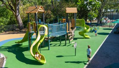 Elevated view of children playing on a park playground.