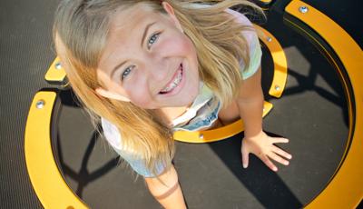 Girl smiling on Netplex play structure