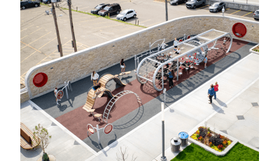 Elevated view of a custom designed playground filled with children.