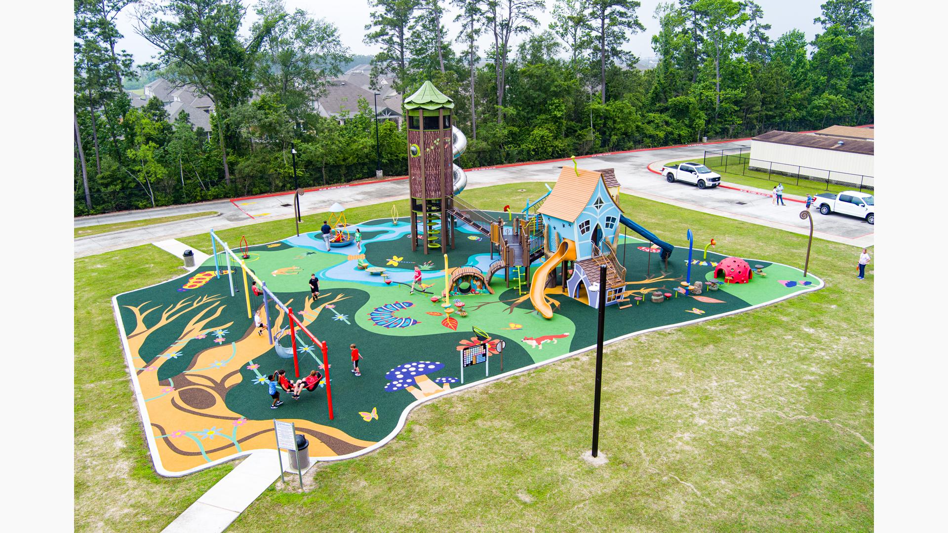 Elevated view of a whimsical nature themed elementary school playground.