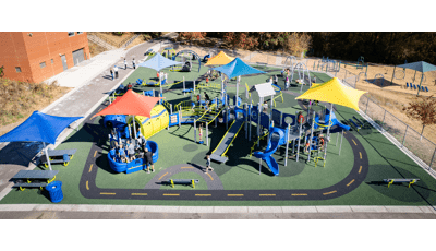 Elevated view of a elementary school playground with road way paths designed into the ground surfacing.