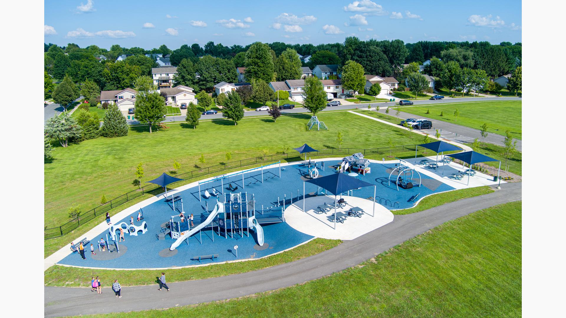 Elevated view of a large inclusive school playground play area.